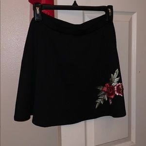 black skirtwith roses